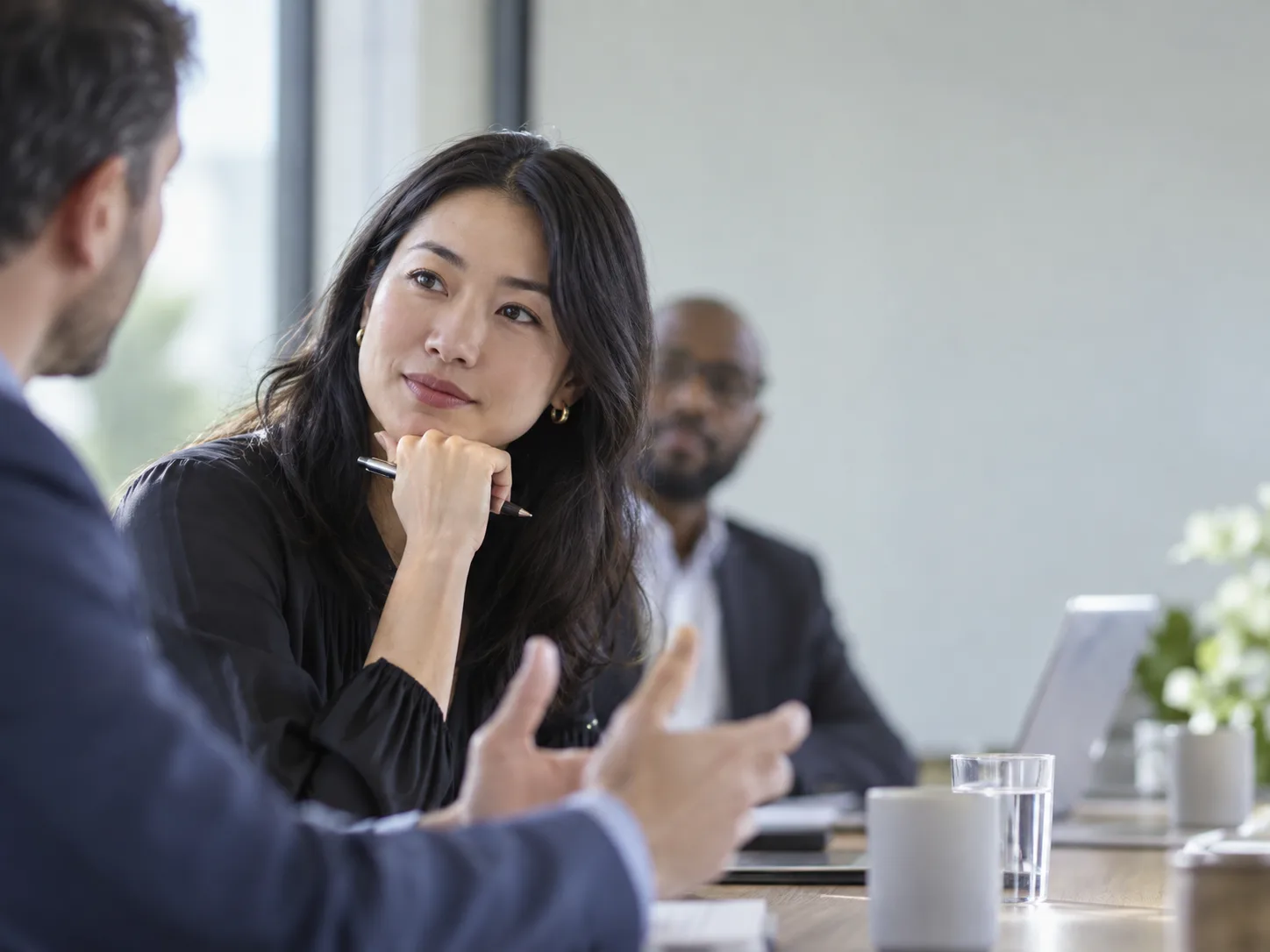 People listening and speaking in a meeting